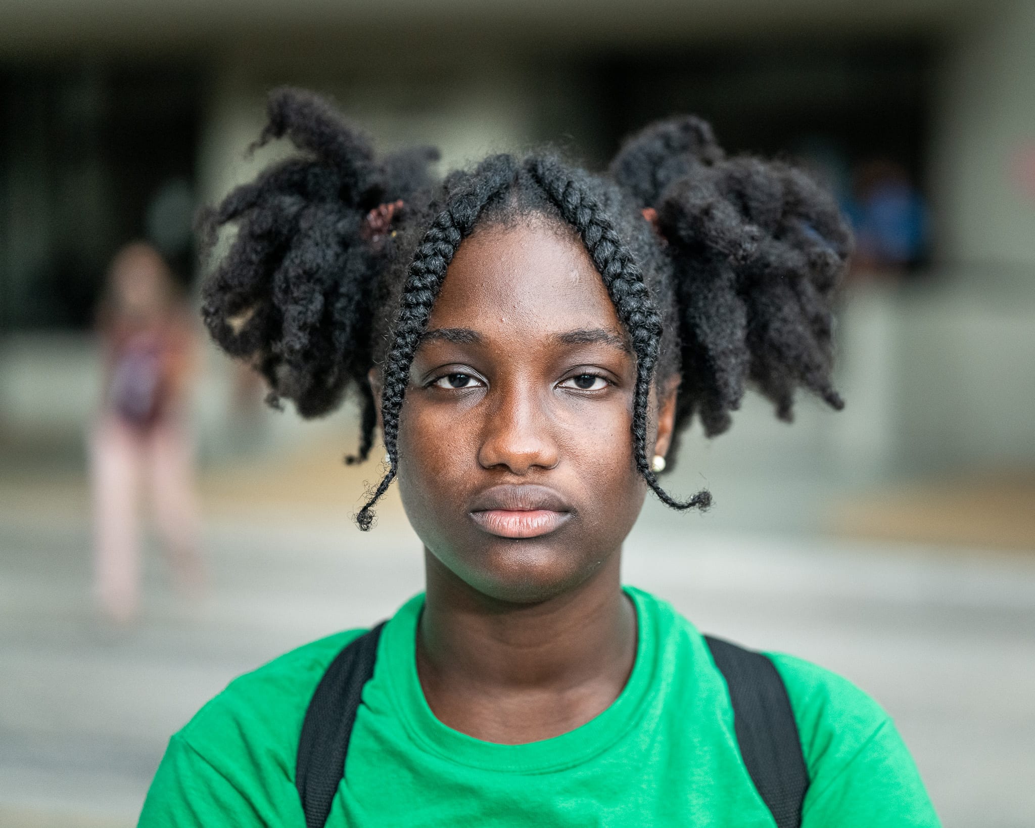 Portrait of a young person with braids